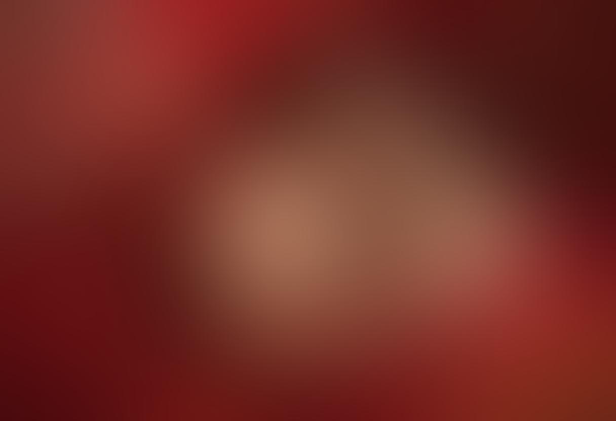 A passionate couple intertwined in an intimate embrace, surrounded by softly glowing candles and rich red silk sheets. The background features delicate floral patterns and vibrant colors that evoke romance and sensuality. Include subtle hints of abstract art to represent desire and exploration of love. super-realistic. vibrant colors. warm ambiance.